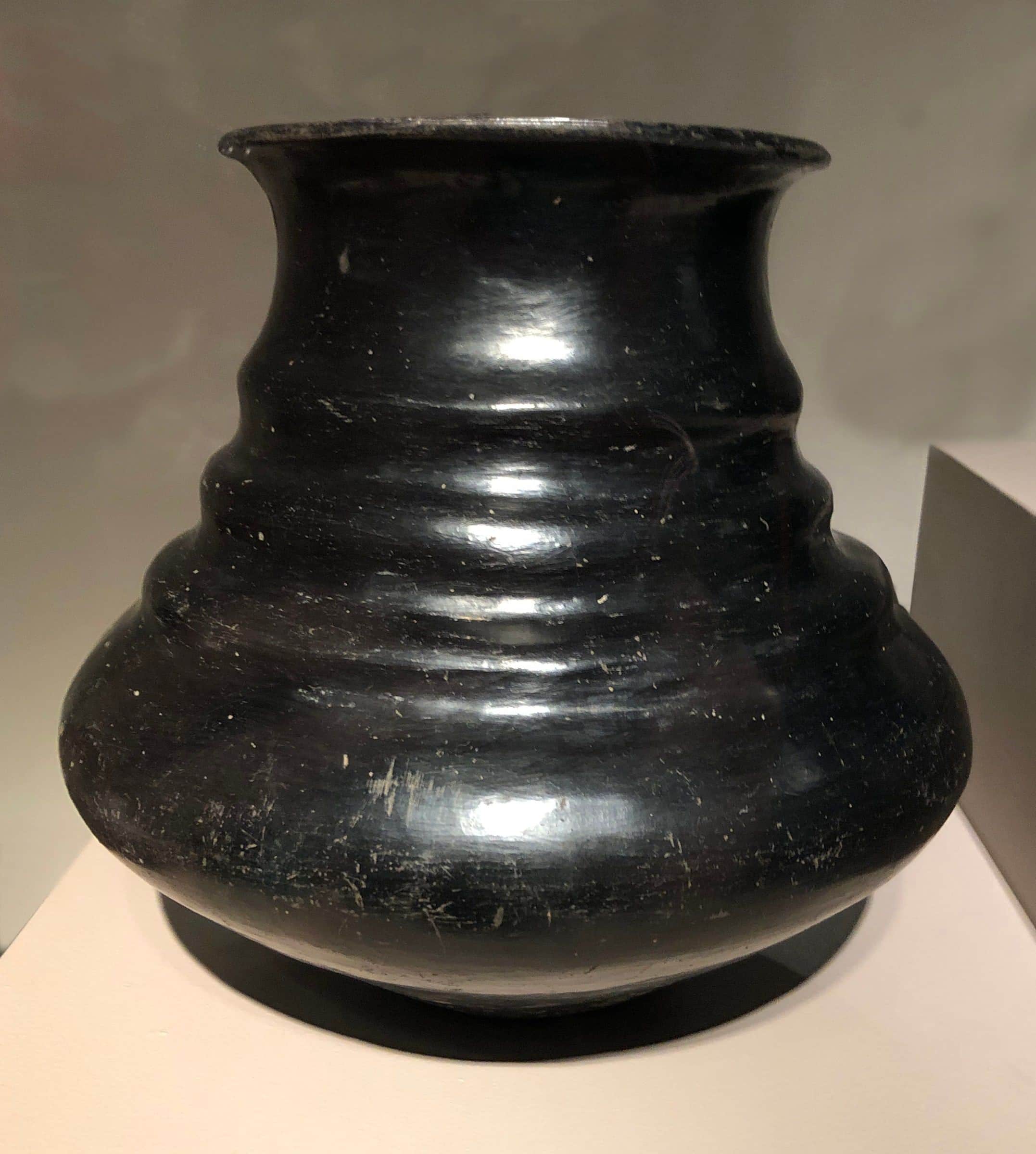 A polished black clay water jar from Santa Clara Pueblo